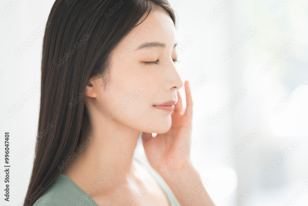 Skin care. Woman with beauty face touching healthy facial skin portrait. Asian woman.
Skin care. Woman with beauty face touching healthy facial skin portrait. Asian woman.