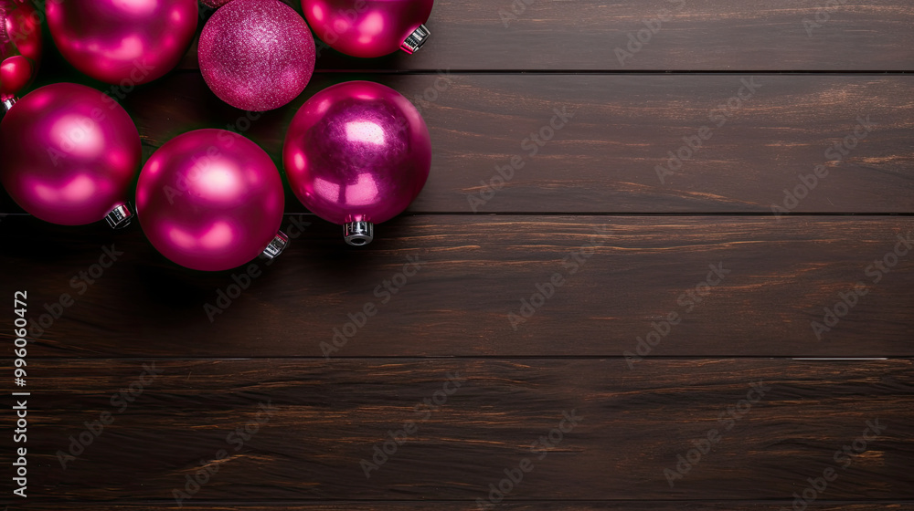 Naklejka premium Set of christmas balls on a dark magenta wooden background or board