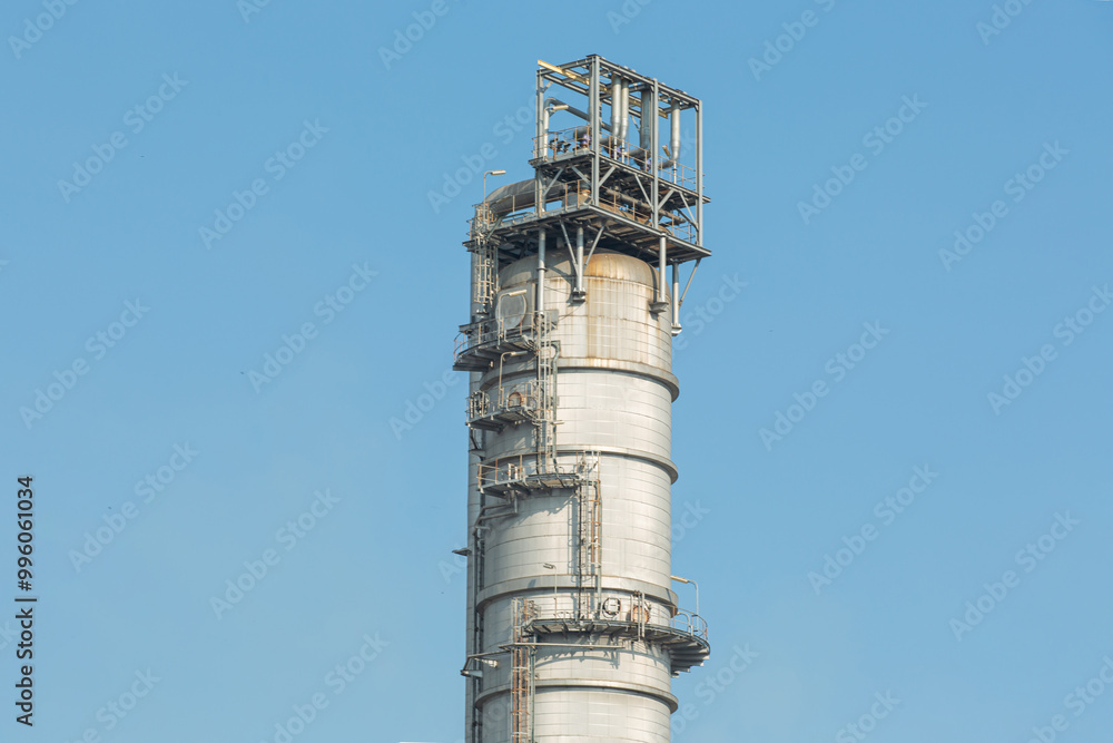 White oil tank storage chemical petroleum petrochemical refinery product at oil terminal. Oil terminal storage tank in deep seaport for the international order concept. White oil tank storage chemical petroleum petrochemical refinery product at oil terminal. Oil terminal storage tank in deep seaport for the international order concept.