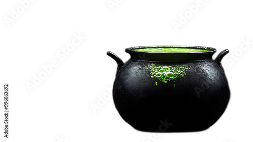 A black cauldron with green bubbling potion placed against a solid black background