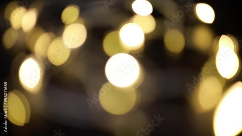 Out-of-focus colored lights blink at different speeds, creating a dynamic and abstract effect against a black background. Ideal as visual backdrop for creative projects and music videos.