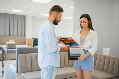 Woman with her husband at the furniture store showroom photo