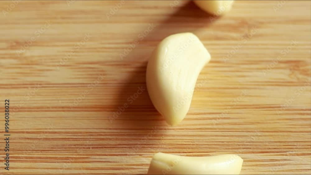 Garlic Clove on Wooden Board Close-Up Garlic Clove on Wooden Board Close-Up