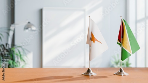 FLAGS OF CYPRUS AND GUYANA ON TABLE