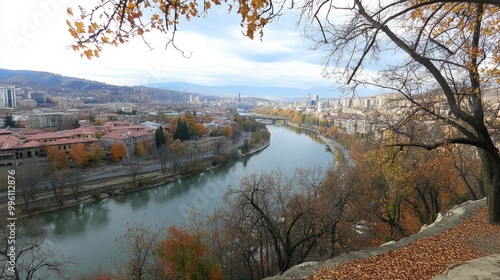 View from Narikala Fortress, overlooking the Old Town and modern skyline of Tbilisi, with the Kura River winding through. photo