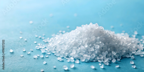 Iodized sea salt crystals on a light blue background , sea salt, iodized, crystals, condiment, seasoning, kitchen, cooking