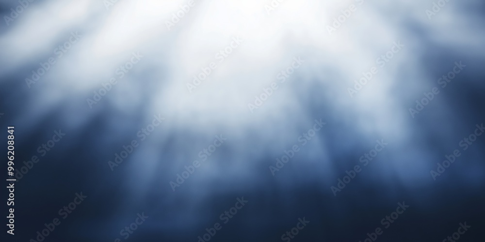 Fototapeta premium Dramatic light rays filter through an unseen source, casting a mystical and otherworldly effect through a cloudy medium.