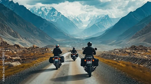 A group of travelers embarking on a motorcycle journey through the winding roads of the Himalayas, with stunning mountain scenery all around. photo