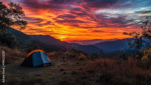 A breathtaking sunrise view from a mountain campsite, with a tent in the foreground and vibrant colors filling the sky, showcasing the beauty of early mornings in nature.