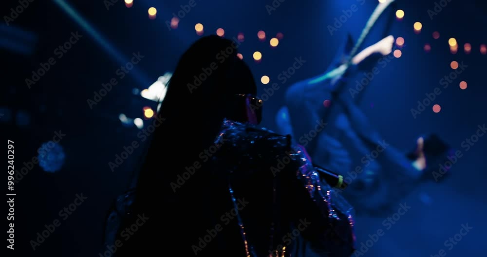 Gig Of Trendy Female Singer In Nightclub, Air Gymnastic Show, Woman Aerialist Flying Above Stage Gig Of Trendy Female Singer In Nightclub, Air Gymnastic Show, Woman Aerialist Flying Above Stage