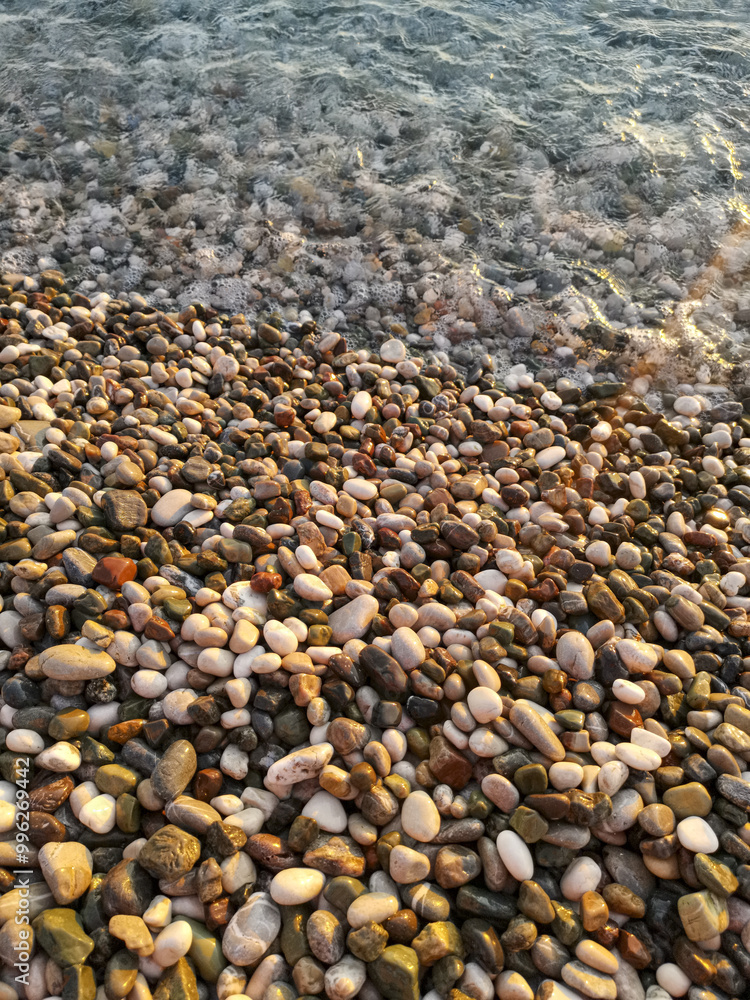 A beach with a large pile of rocks A beach with a large pile of rocks
