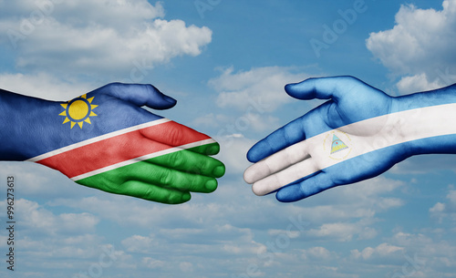 Nicaragua and Namibia country handshaking with flags, consensus concept international co-operation illustration