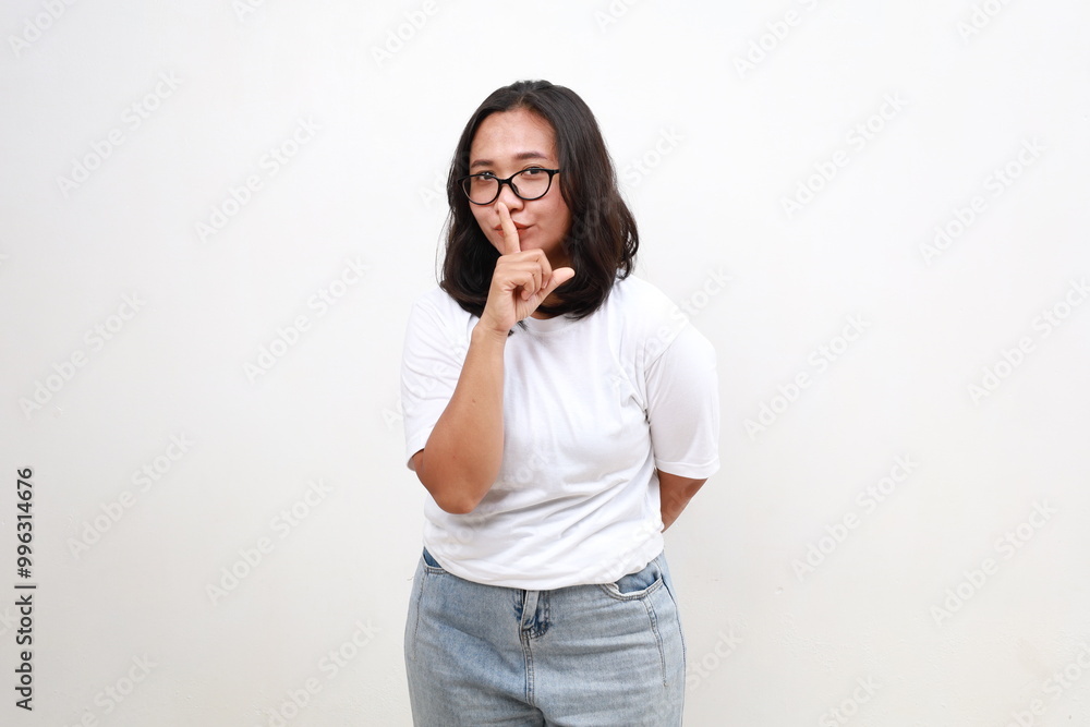 Lifestyle, people emotions and casual concept. Smiling cute asian girl asking keep secret, take promise not tell or be quiet about it, show shush sign, hush with finger over mouth, prepare surprise Lifestyle, people emotions and casual concept. Smiling cute asian girl asking keep secret, take promise not tell or be quiet about it, show shush sign, hush with finger over mouth, prepare surprise