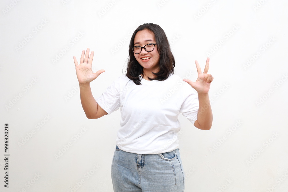 Smiling happy good-looking asian girl giving advice, showing eight fingers as explain rules, make point, standing white background Smiling happy good-looking asian girl giving advice, showing eight fingers as explain rules, make point, standing white background