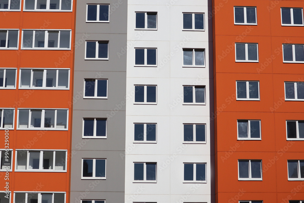 Modern high-rise buildings close-up windows of the house. Multi-storey residential building Modern high-rise buildings close-up windows of the house. Multi-storey residential building
