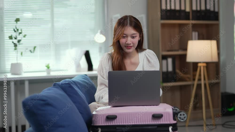 Woman booking a vacation rental online using a laptop, planning her next trip with excitement and anticipation Woman booking a vacation rental online using a laptop, planning her next trip with excitement and anticipation