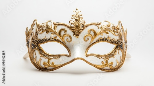 Intricately designed masquerade mask with ornate gold detailing typical of an opera carnival set against a white background photo