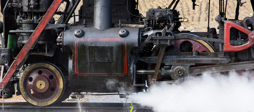 Fototapeta premium Close-up of part of an old black steam locomotive