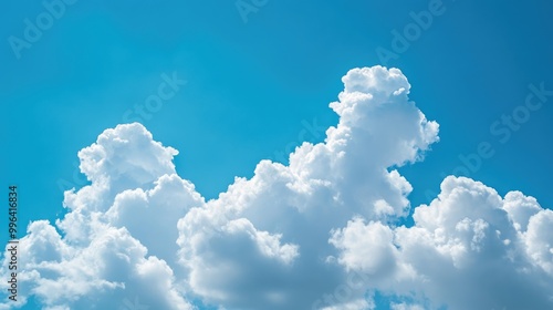 Clear blue sky featuring fluffy white clouds ideal for a backdrop with ample copy space