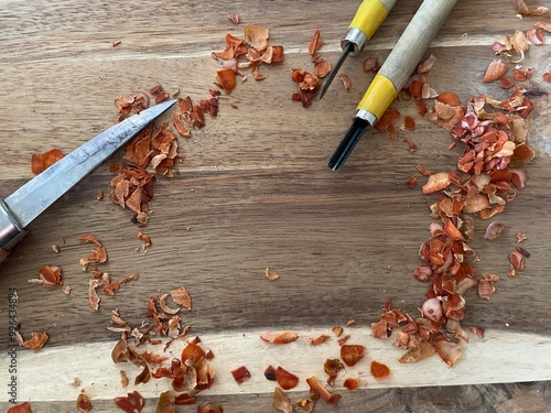 Carving equipment and wooden flaked making a frame for text