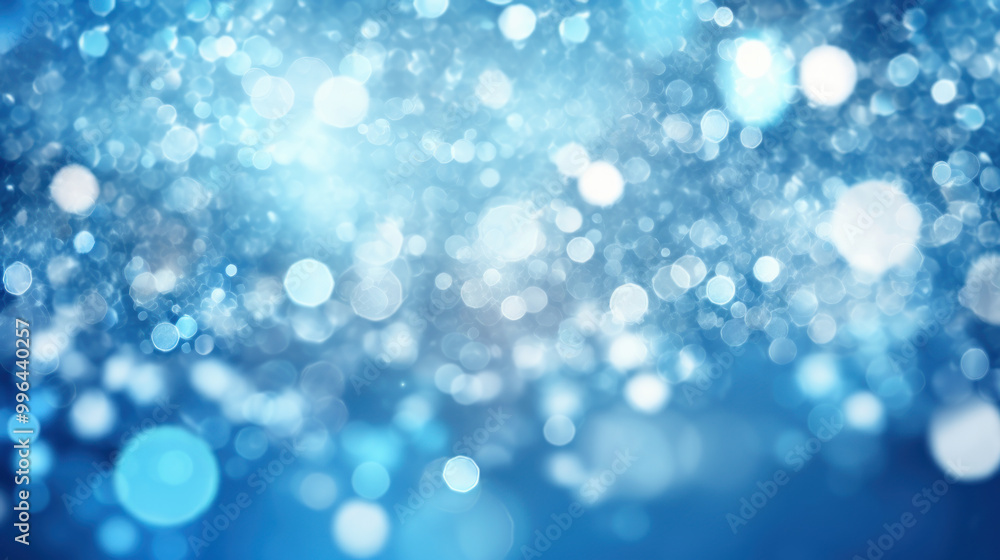 Blur bookeh silver lights or flashes on a vivid blue color background Blur bookeh silver lights or flashes on a vivid blue color background
