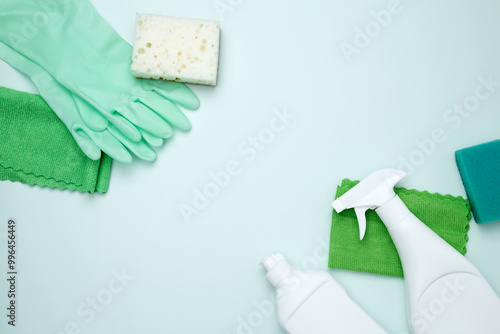 Cleaning supplies and tools, including bottles, gloves, sponges, and cloths. Concept of cleanliness and hygiene photo