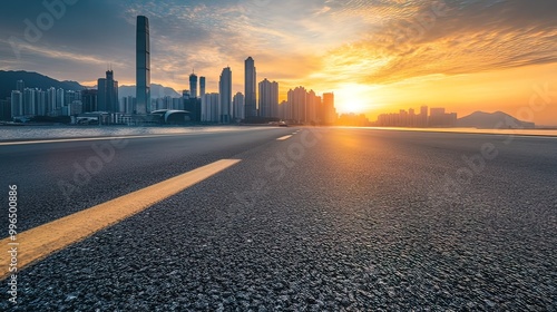 Sunrise Over a Modern Cityscape with Empty Road