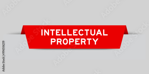 Red color inserted label with word intellectual property on gray background