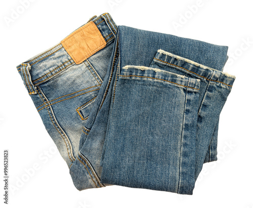 Folded dark blue jeans on a white background. Cloth. Jeans isolate