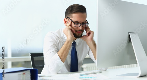 Foto Portrait of tired clerk massage face with finger sit in front of computer, not feeling well