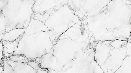 Elegant white marble texture with dark veining, perfect for backgrounds and design elements.