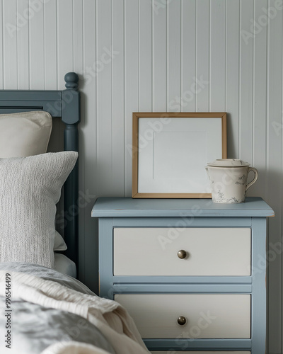 A empty poster in frame above a bed. AI generated