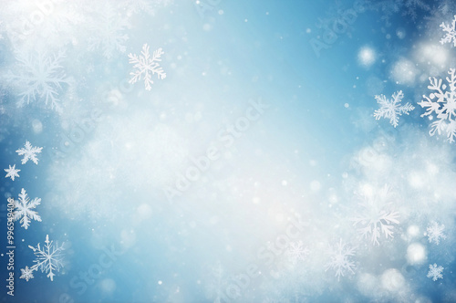 Blurred christmas background. Snow and snowflakes on blue with light bokeh.