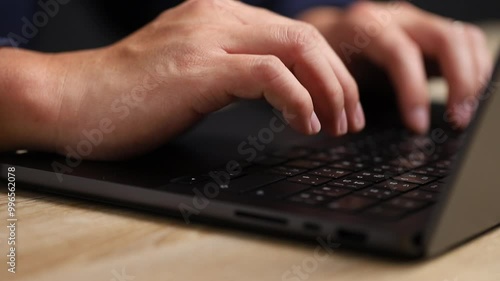 Close up shot user or developer using laptop and typing on keyboard