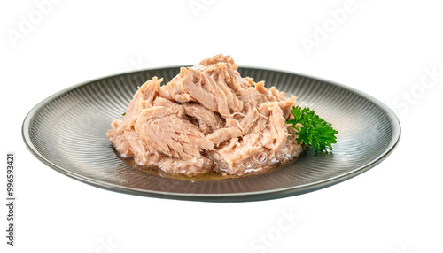 Plate of shredded tuna laid on a patterned dish with a garnish of parsley, white isolate background