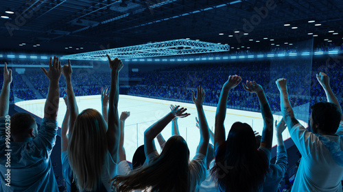 Принти на полотні Fans cheer in hockey stadium, raising their hands toward ice rink