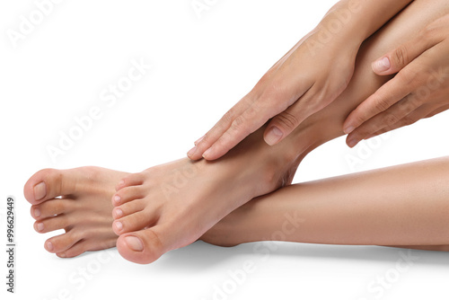 Woman touching her smooth legs on white background, closeup