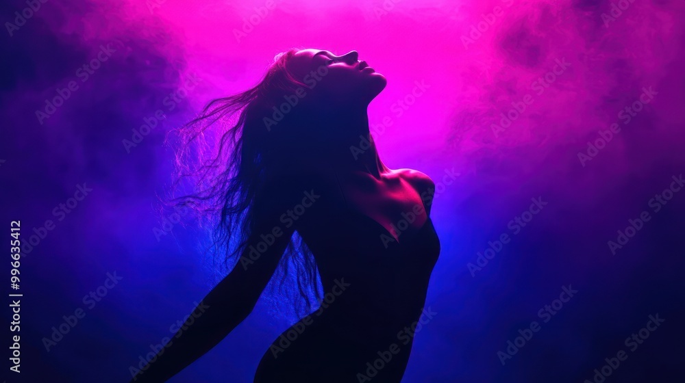 Silhouette of a woman with long hair looking up in a dark smoky background with a vibrant pink and blue gradient. Silhouette of a woman with long hair looking up in a dark smoky background with a vibrant pink and blue gradient.