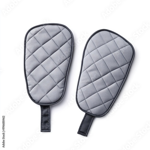 Stylish and functional gray oven mitts designed for safe handling of hot cookware in the kitchen. photo