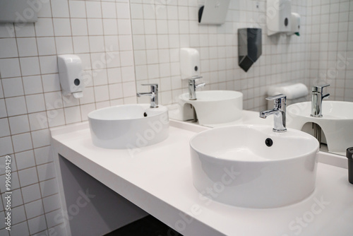 White sink in the public bathroom, modern design. photo