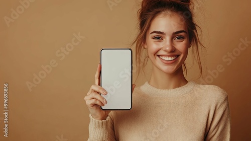 Smiling Woman Holding Smartphone with Blank Screen