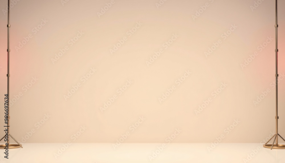 Simple studio setup with two gold stands and peach background. Simple studio setup with two gold stands and peach background.