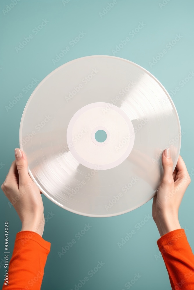 Vinyl record package holding hand technology. Vinyl record package holding hand technology.