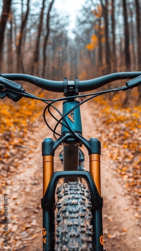 a mountain bike on a dirt road in the fall photo