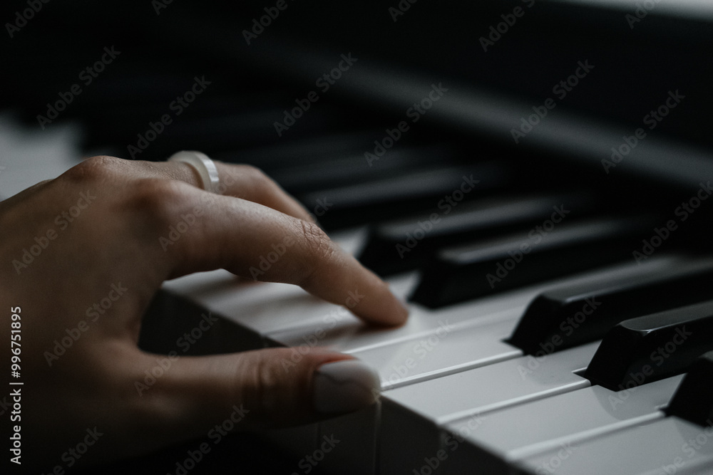 Fototapeta premium Close-Up Shots of Playing Piano Keys