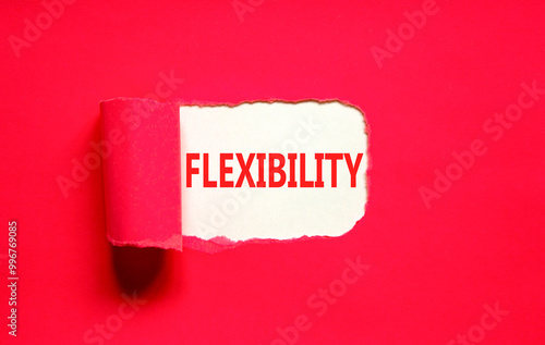 Flexibility symbol. Concept word Flexibility on beautiful white paper. Beautiful red paper background. Business flexibility concept. Copy space. photo