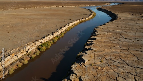 Aerial view of a dried-up riverbed stretching across the landscape. photo