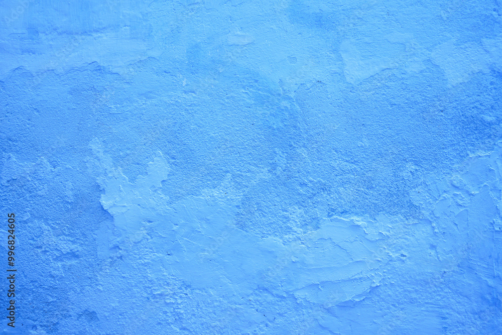 Blue textured wall of an old house Blue textured wall of an old house
