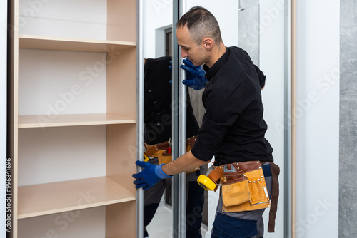 фотографія The man is engaged in repair and furniture assemblage