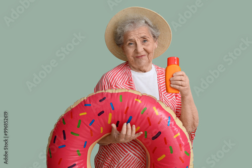 Senior woman with sunscreen...